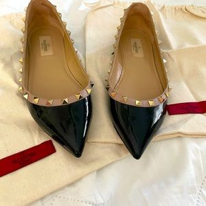 Valentino Rockstud Black Patent flat with taupe trim and gold rock studs.